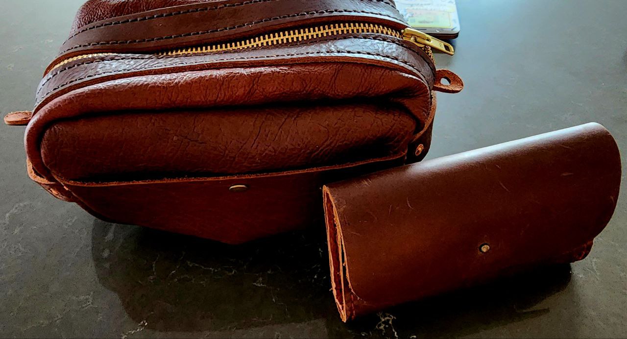 Handcrafted leather purse showing traditional craftsmanship and stitching skills